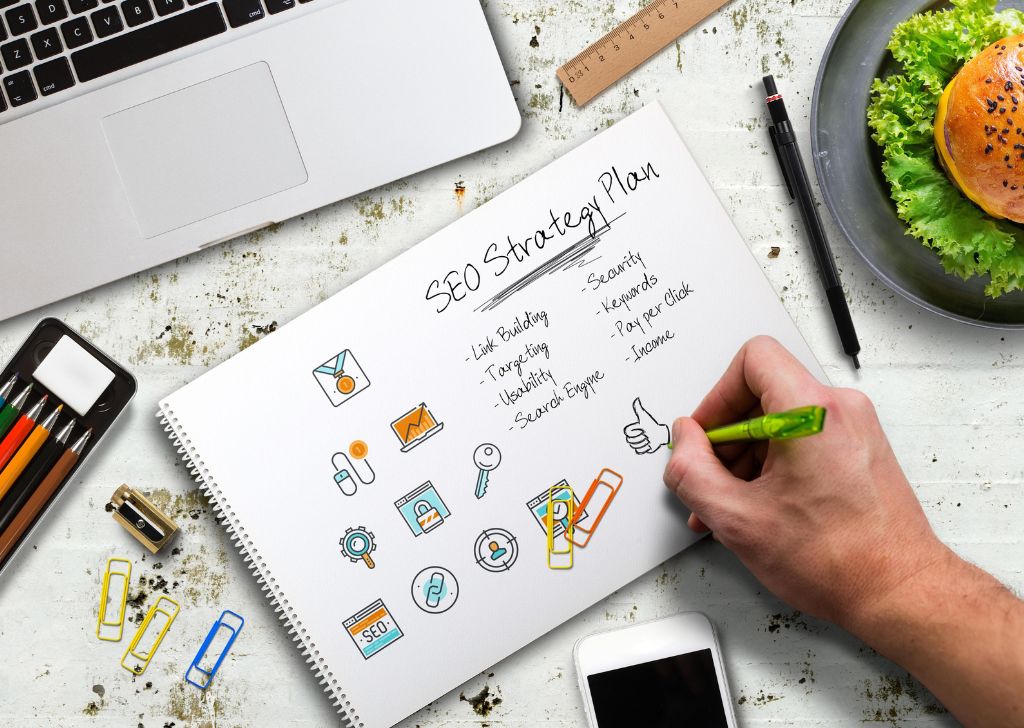 A SEO specialist writing down SEO strategies to grow a dental clinic.