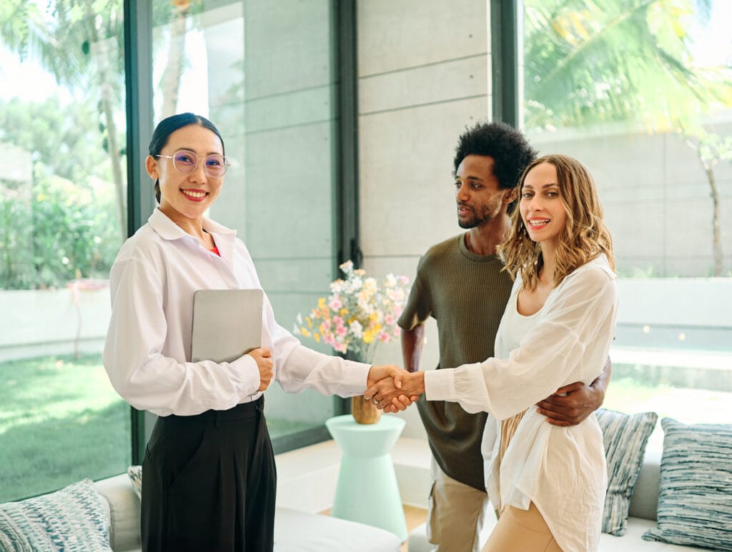 property agent shaking hands with customer