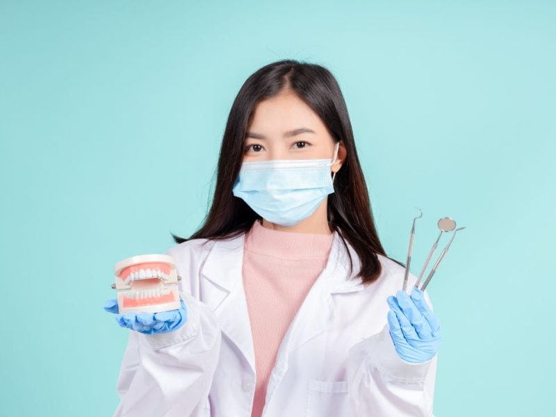 Dentist showing how to grow a dental clinic using SEO vs PPC.